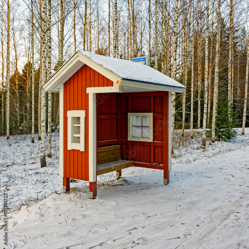 Roadside bus stop on rural road photo