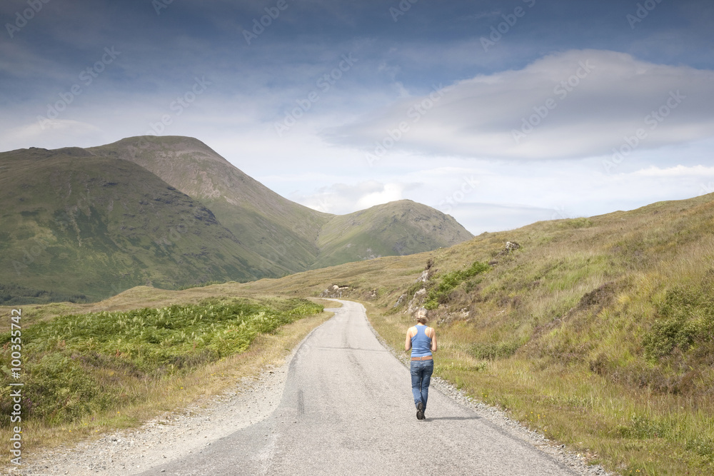 Woman on Empty Road; Isle of Mull; Scotland; UK