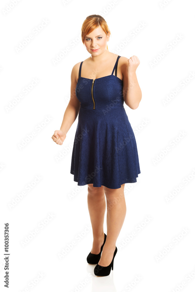 Overweight woman with her fists up Overweight woman with her fists up