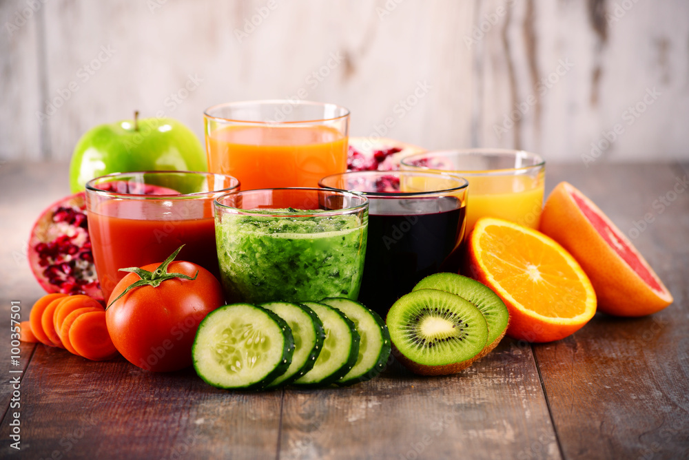 Glasses of fresh organic vegetable and fruit juices Glasses of fresh organic vegetable and fruit juices
