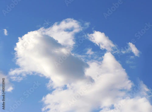 Blue sky with fluffy white clouds in day light