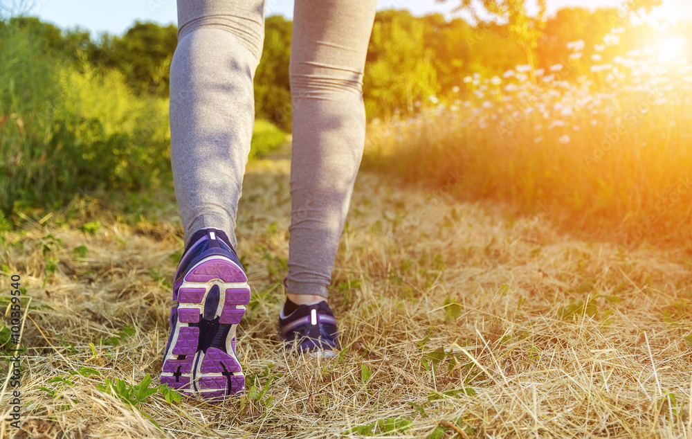 Woman running in a field Woman running in a field