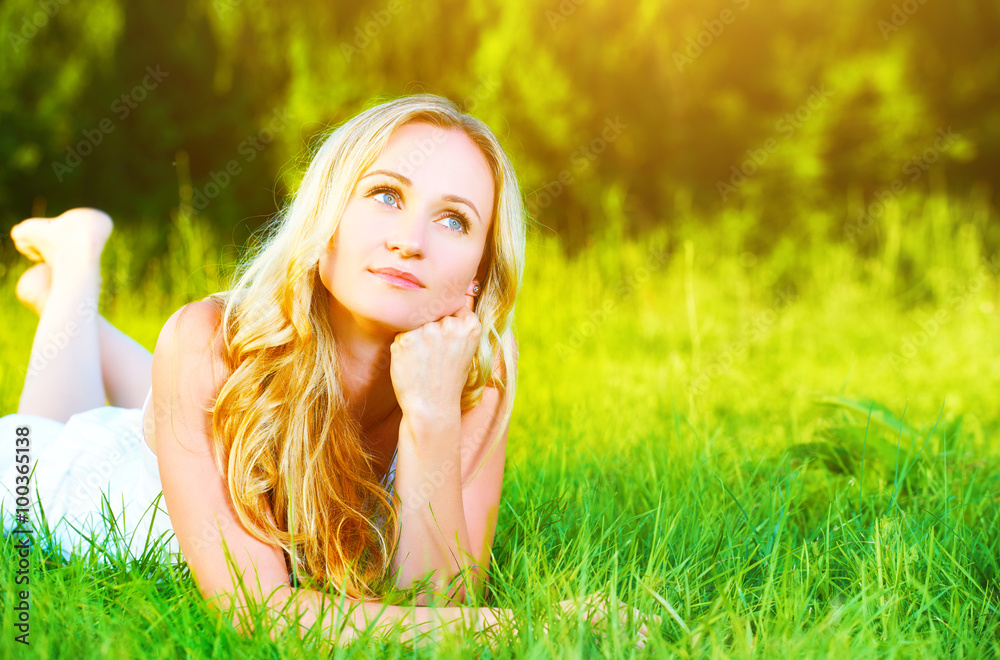 beautiful happy dreamy woman in summer on nature lying on grass beautiful happy dreamy woman in summer on nature lying on grass