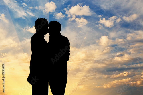 Silhouette happy gay kissing