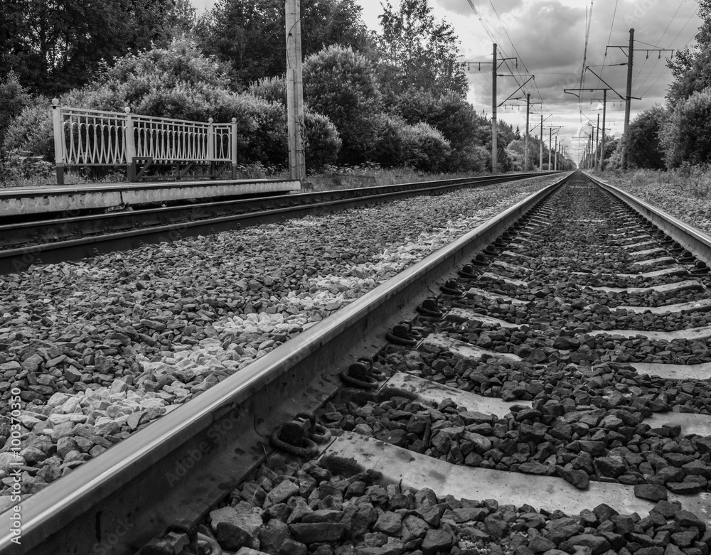 Railway receding into the distance. Along the railway poles - electric transmission line.
Railway receding into the distance. Along the railway poles - electric transmission line.