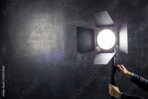 Using light equipment in photo studio