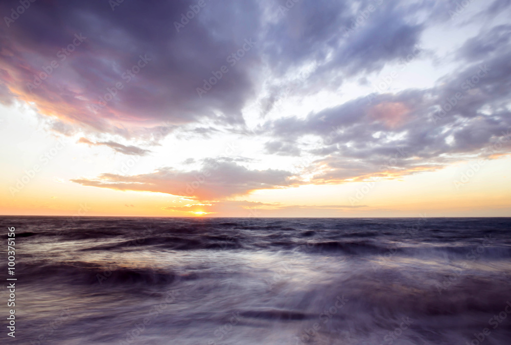 purple sunset over rough sea