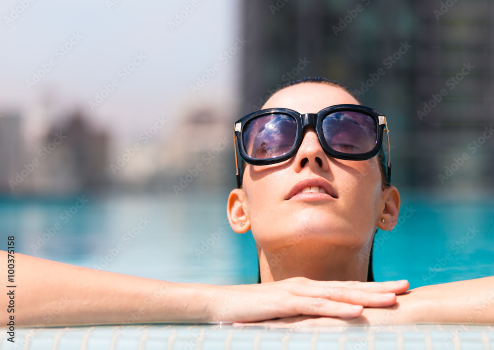 Female beauty portrait in a pool setting. Female beauty portrait in a pool setting.