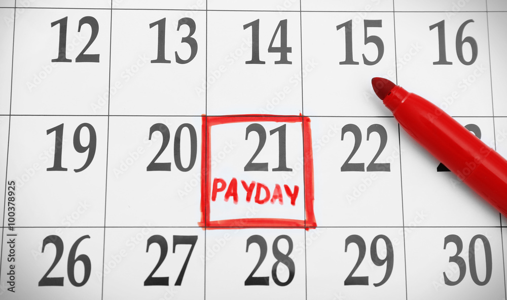 Payday concept. Calendar with red felt pen background. Date in frame, close up Payday concept. Calendar with red felt pen background. Date in frame, close up
