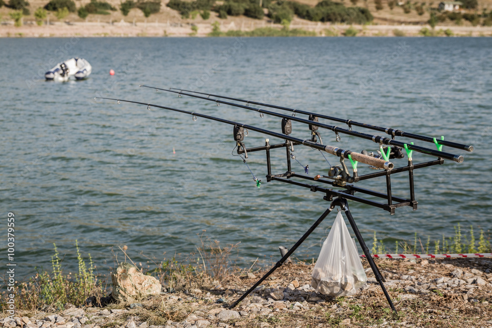 Reels on Fishing Rods Near Lake