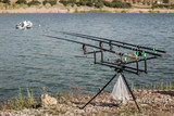 Reels on Fishing Rods Near Lake