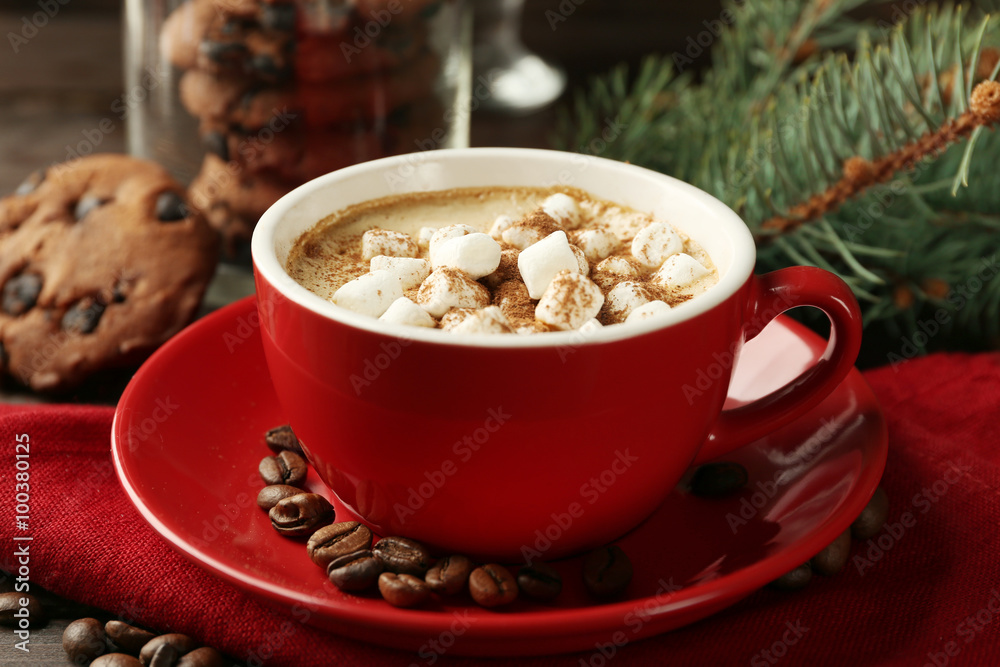 Mug of hot chocolate with marshmallows, fir tree branch on wooden background Mug of hot chocolate with marshmallows, fir tree branch on wooden background