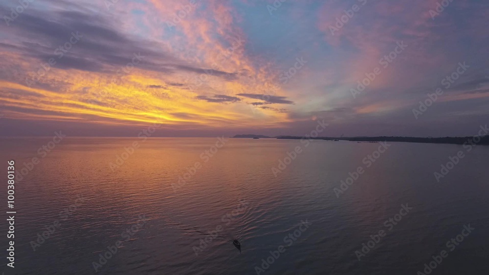 Beautiful aerial view of the sunset, jetty and fishing boats during the golden hour sunset Beautiful aerial view of the sunset, jetty and fishing boats during the golden hour sunset