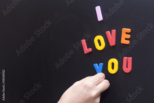 I love you magnetic letters at board..
