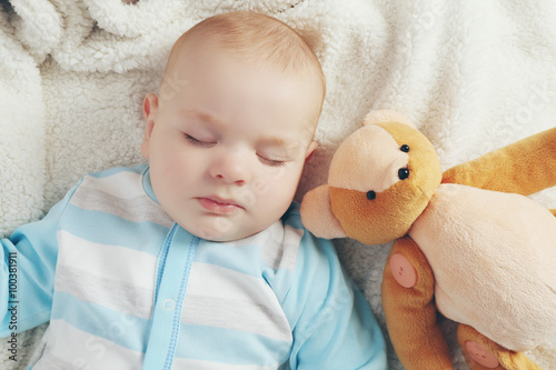 Adorable baby sleeping with...