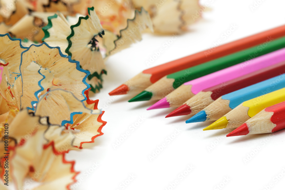 Sharp pencil with shavings lie on the office desk Sharp pencil with shavings lie on the office desk