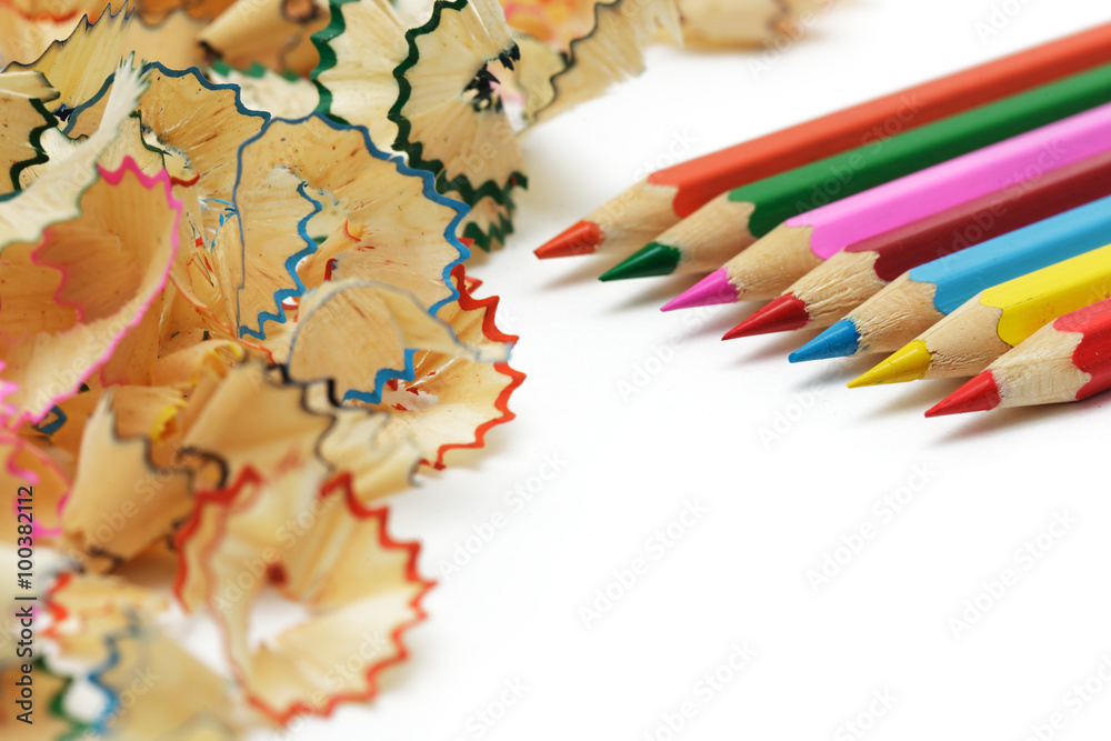 Sharp pencil with shavings lie on the office desk Sharp pencil with shavings lie on the office desk