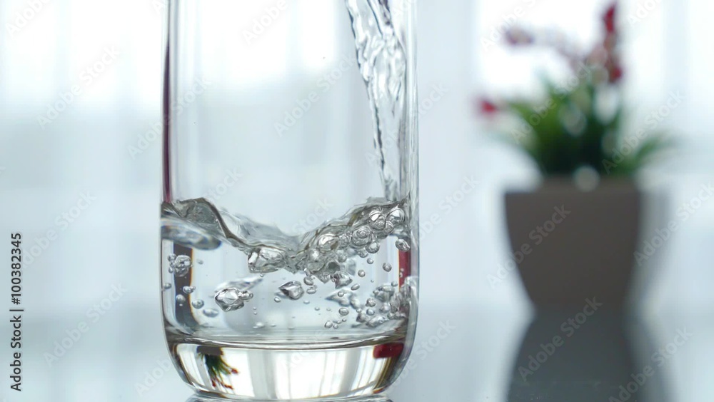 Pouring Water in a Glass. Closeup. Pouring Water in a Glass. Closeup.