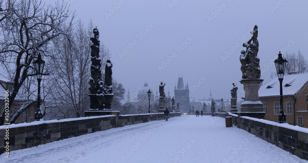 Early Morning romantic snowy Prague Old Town from Charles Bridge, Czech republic