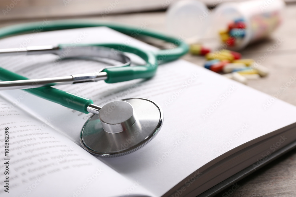 Stethoscope on a book, close up Stethoscope on a book, close up