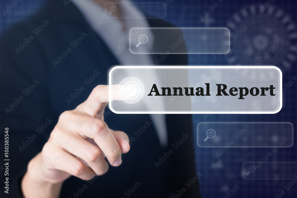 Businessman pressing a Annual Repor concept button. Can be used in advertising. Businessman pressing a Annual Repor concept button. Can be used in advertising.