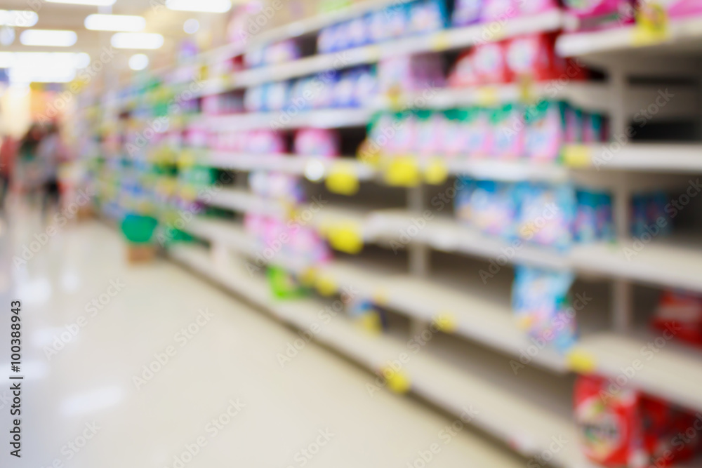 detergent shelves in supermarket or grocery store blurred backgr