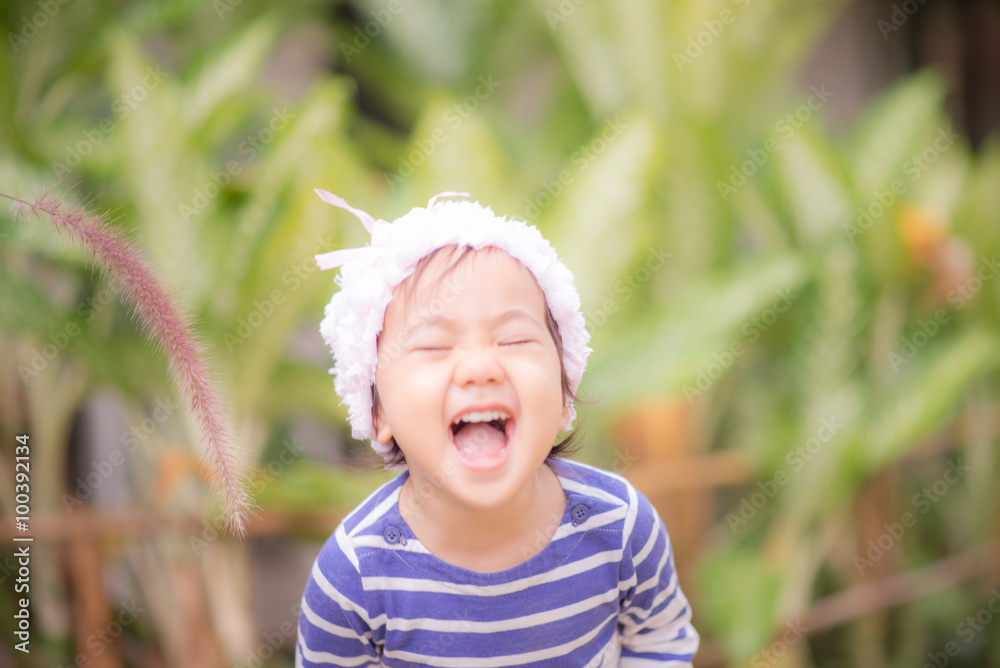 Little cute asian girl touching flower grass black and white Little cute asian girl touching flower grass black and white