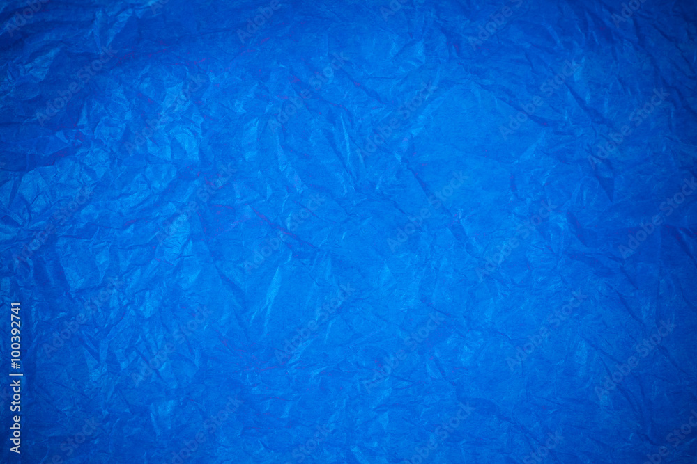 Obraz premium Blue crumpled paper surface background.