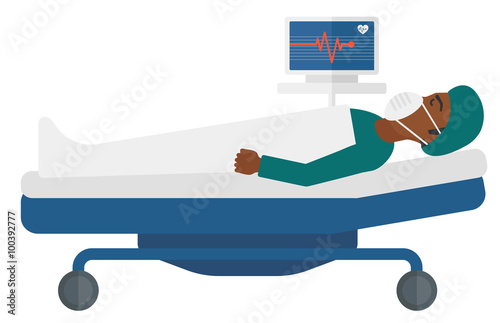 Patient lying in bed with heart monitor.