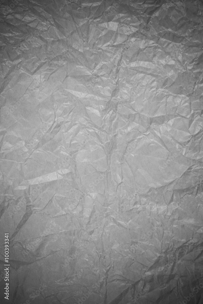 Naklejka premium Gray crumpled paper recycling background.