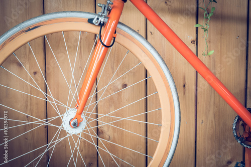 fixed gear bicycle parked with wood wall  close up image