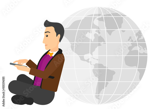 Man sitting near globe.