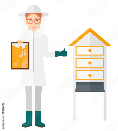 Bee-keeper at apiary.
