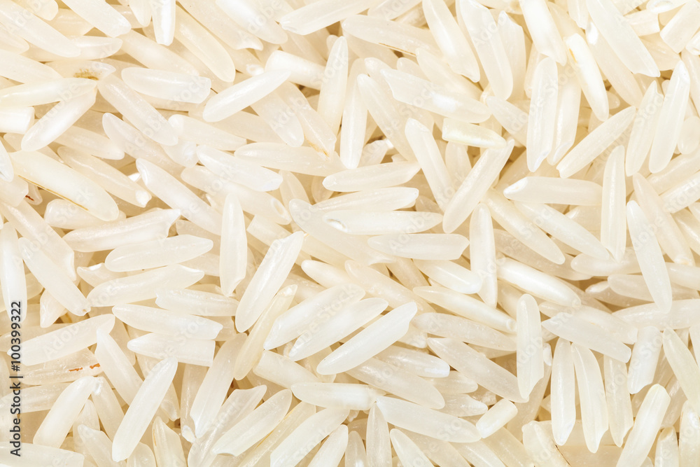 long-grain uncooked white Basmati rice close up long-grain uncooked white Basmati rice close up