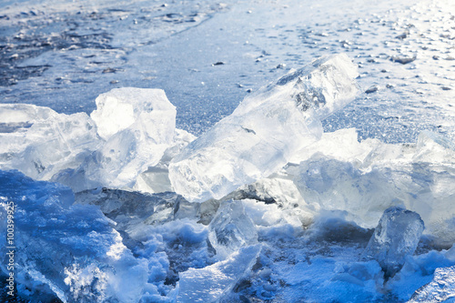 ice blocks on the edge of clearing in frozen river