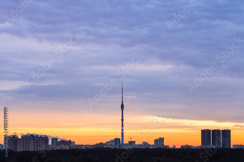 Early blue sunrise and skyline with TV tower