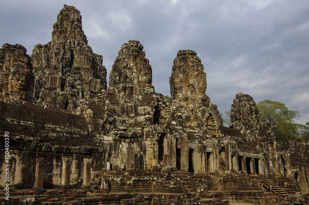 Face stone of ancient Bayon Temple in Angkor Wat, Siem Reap, Cam Face stone of ancient Bayon Temple in Angkor Wat, Siem Reap, Cam