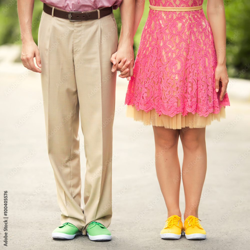 Couple feet with color sneakers Couple feet with color sneakers