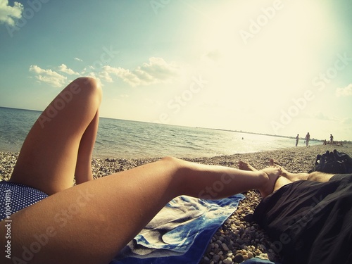 antalya, beach, Antalia coast, calm sea, the girl and the guy on vacation, sexy, pebble beach, girl in a blue bathing suit photo