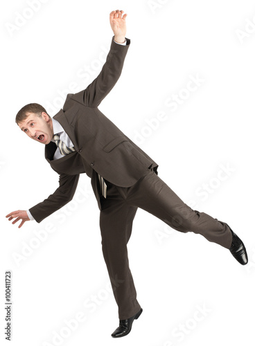 Businessman almost falling 