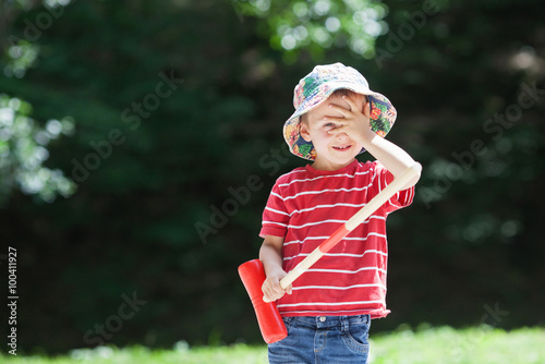 Cute boy, playing croquet