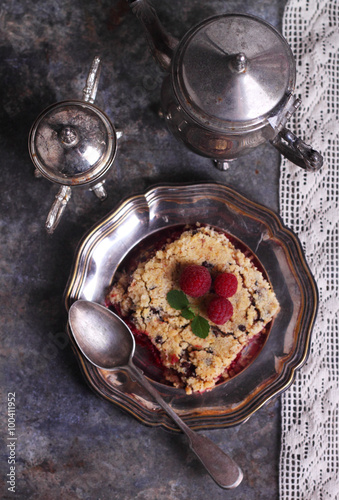 raspberry crumble in a metal plate with a fork