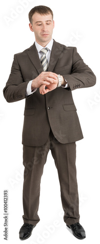 Businessman looking at his hand
