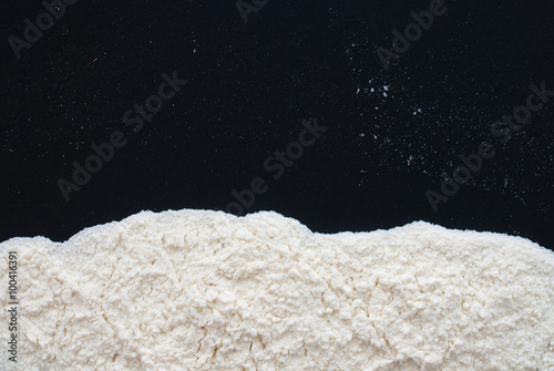 white flour on black background - free space for text