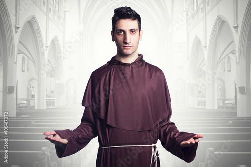 young friar praying