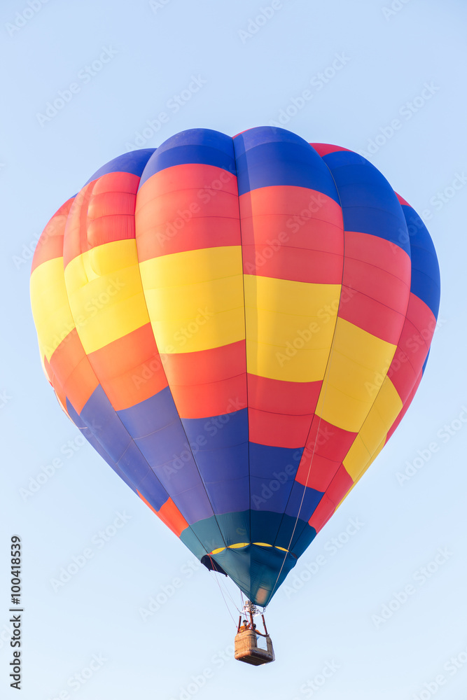Naklejka premium Colorful hot air balloon with blue sky background