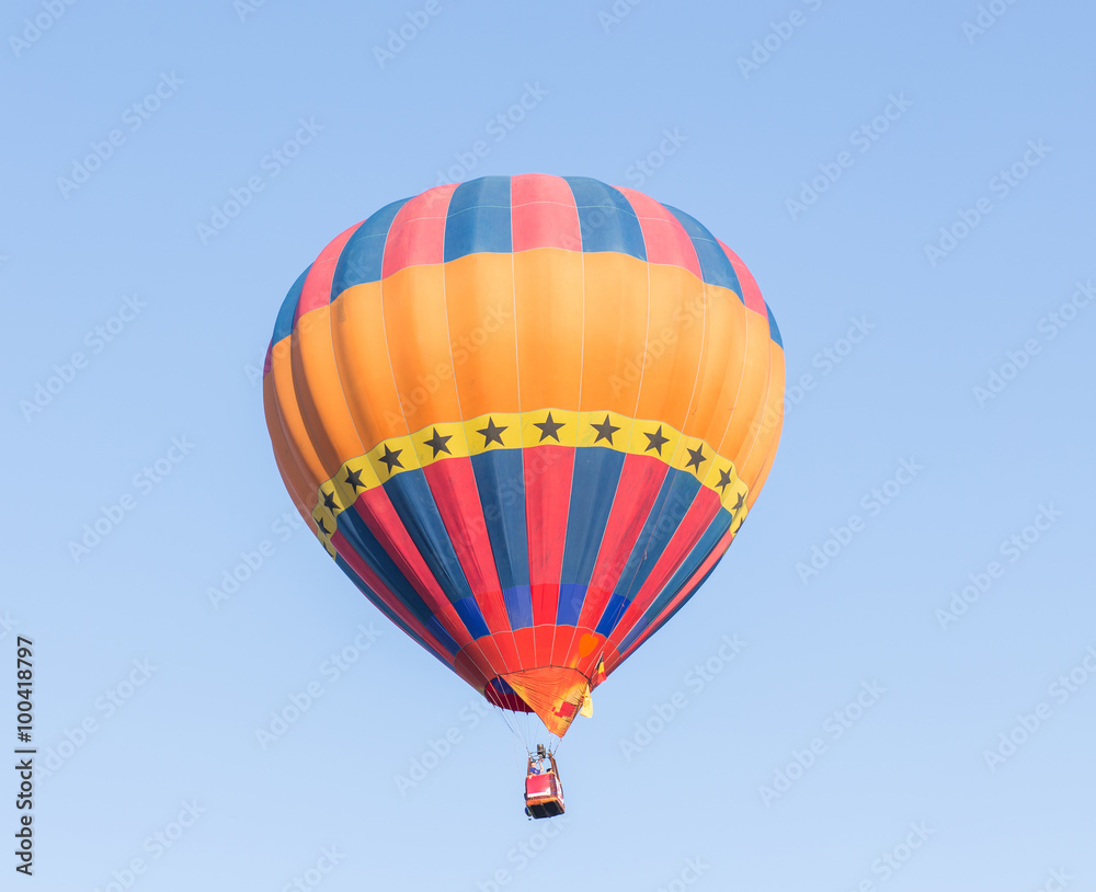 Obraz premium Colorful hot air balloon on blue sky background