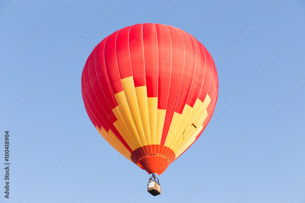 Fototapeta premium Colorful hot air balloon on blue sky background