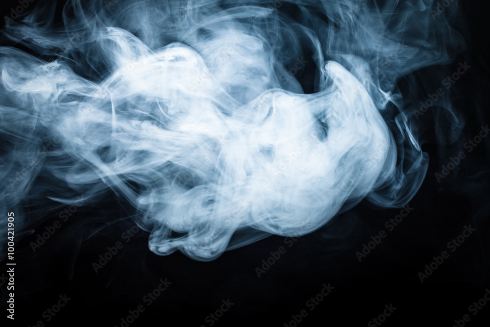 Smoke on a black background. Defocused. Toned