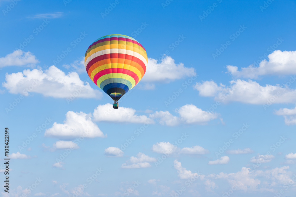 Fototapeta premium Colorful hot air balloon on blue sky background